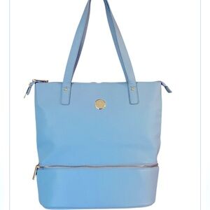 Spring Tote by JOY in a periwinkle lavender blue color. New, never used.